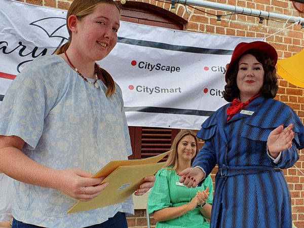 Mary Poppins presenting the Anne Miller Young Writer's Encouragement Award