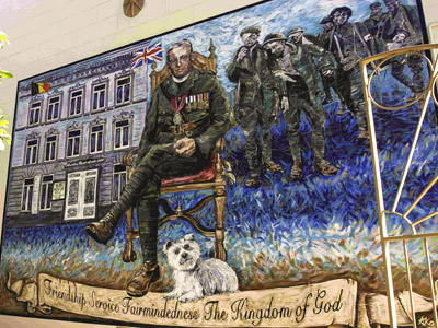 Large mural depicting Rev. Tubby Clayton with his dog Chippie at the military museum in Maryborough