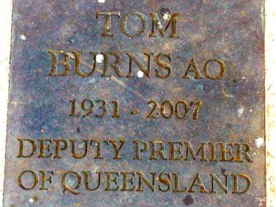 Metal plaque honouring Tom Burns AO, former Deputy Premier of Queensland.