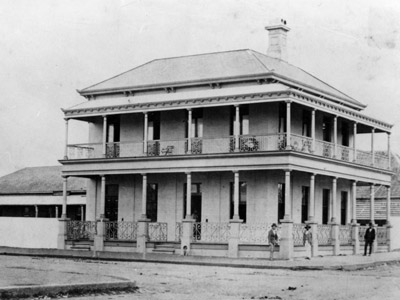 Historic photograph of the two‑storey Heritage Centre building.