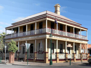 Maryborough Heritage Centre building with wraparound balcony, ornate ironwork, and heritage signage.