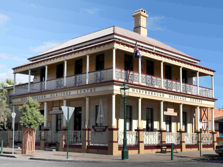 Maryborough Heritage Centre building with wraparound balcony, ornate ironwork, and heritage signage.